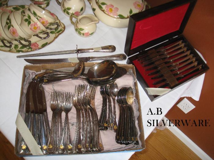 Anheusuer Busch silverware with emblems on the handle