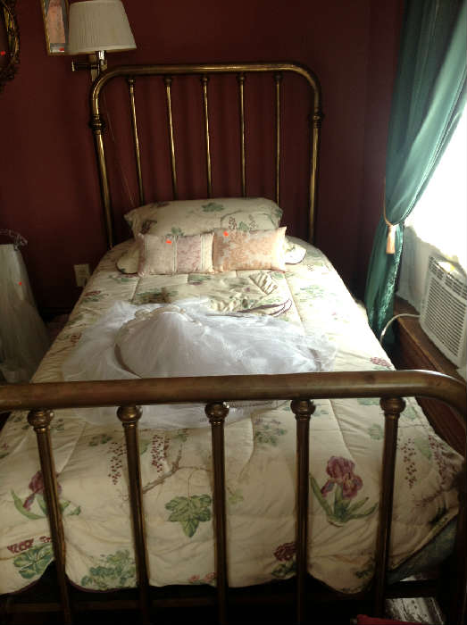 Antique Brass tubing twin beds.