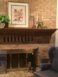 Framed art; wing back chair; fireplace tools