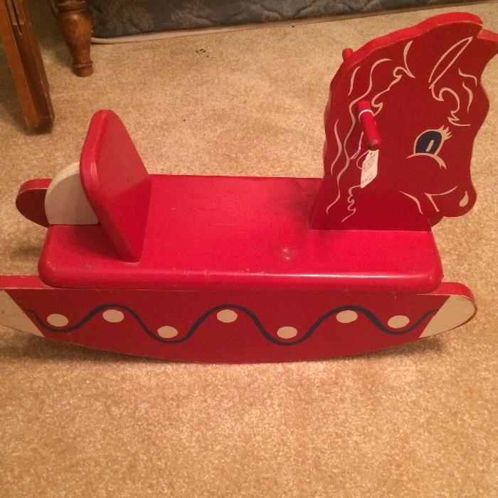 Small red rocking horse