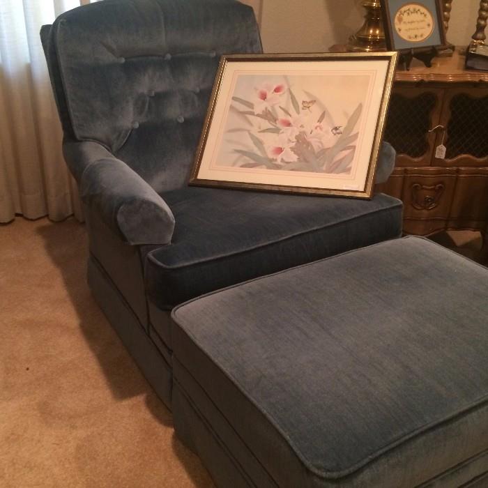 One of two blue chairs; one ottoman