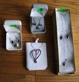 Sterling mounted Teardrop Amethyst pendant w/matching earrings ~ Sterling mounted square cut Amethyst pendant w/square link chain and matching square earrings ~ Sterling mounted Oval cut Amethyst pendant w/oval earrings ~ Unique Heart shaped pendant w/light and dark Amethyst stones on Sterling chain 