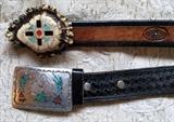 Silver belt buckle with turquoise and coral insets.  Elk antler belt buckle with turquoise and coral insets.