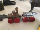 World War I army tractor and trailer with bomb.  Vintage metal toys.