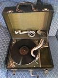 Circa 1920's Portable phonograph and 78 RPM records.