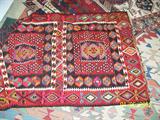 All are hand woven; 5 are actual
prayer rugs (one a door enclosure for a tent); 1 a Keyseri Kilim (the
largest--area rug); 1 a Tribal picture design, woven by the household to
show what their world looked like (animals, birds, etc.); 1 completely
unidentifiable save for the fact that it is 2 pieces stitched together and
was likely a "working " rug of some kind (on a horse, perhaps as a blanket
as I recall? ) and lastly, a Classic Tekke Turkome. It has a certificate that shows is it over 50 years old. It has natural dyes and solid borders.