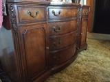 Solid wood bow front buffet with applique