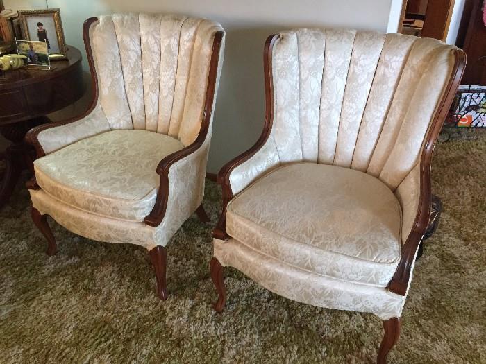 Pair of upholstered queen anne style wing back chairs