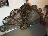 Fan shaped brass fireplace screen