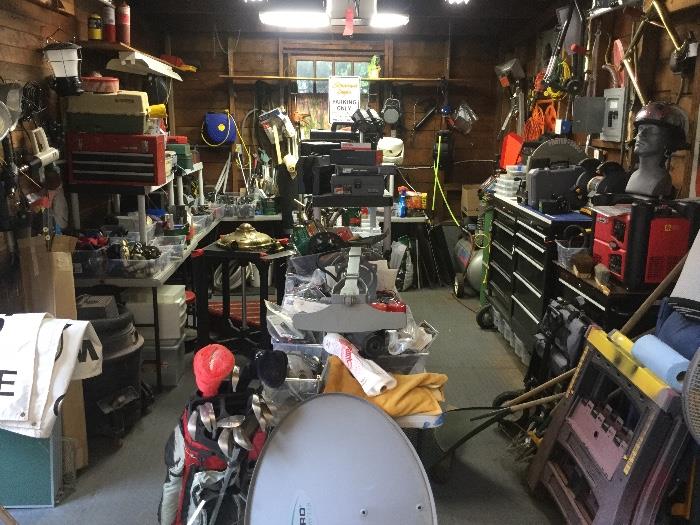 One side of the garage - packed with hand tools and power tools.