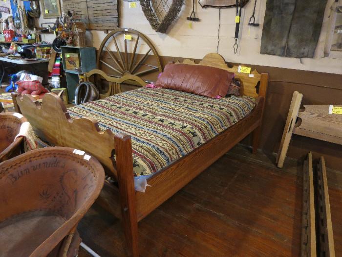 A closer look at this 3/4 custom made bed.  Also notice the primitive youth bed to the right.