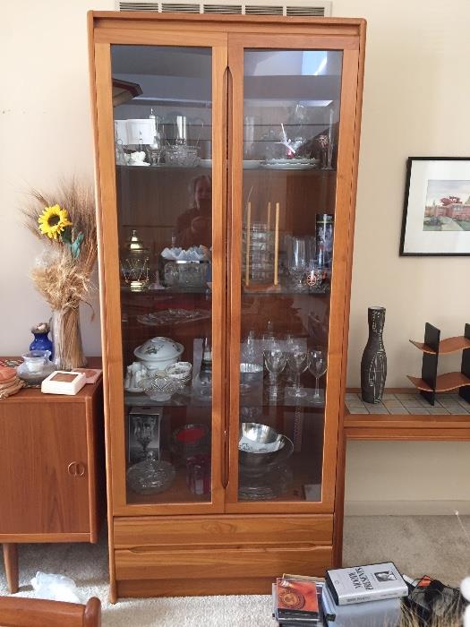 Teak display cabinet with glass doors.