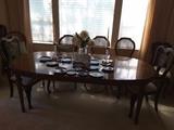 Dining Room Table, Cane Back Chairs, 2 Asian In-laid Chairs in Black, Collection of Copenhagen Blue Plates. Crystal Vase with Fake Flowers. Crystal Candle Holders.
