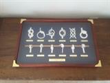 Framed Nautical Collection of Knots in a Brown Frame. All Knots labeled with Names of the Knots.