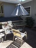 Round Glass Patio Table, Umbrella and Stand and 4 Metal/Plastic Patio Chairs.