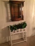 curio shelf and white vintage planter