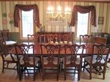 Thomasville dining room table with 12 chairs.