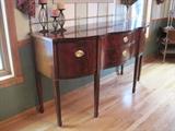 Thomasville sideboard with inlaid bell-flower decoration and a brass gallery top rail.