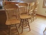 Four pressed back bar stools.
