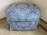 Damask ottoman with matching armchair.
