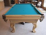 Pool table with table tennis top and cue rack.