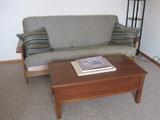 Futon sofa bed. Coffee table.