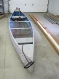 17" Smoker Craft canoe with paddles and life jackets.