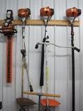Stihl hedge trimmer, weed whip and extension chainsaw.