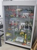 John Deere collectibles. Car collectibles. Display case.