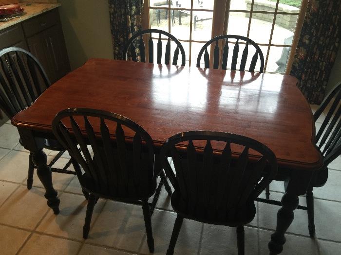 Gorgeous hard wood table with six chairs for kitchen or dining room.