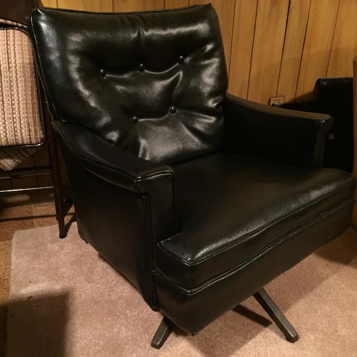mid-century black swivel chair
