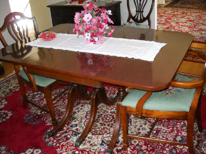 beautiful; dining table with leaves and upholstered, shieldback chairs