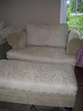one of 2 overstuffed chairs with matching ottomen, all with wooden feet