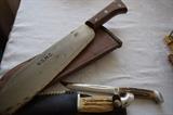 Smaller knife is Case brand.