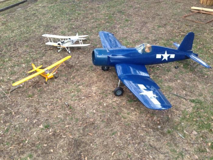 Dozens upon dozens of hand crafted model gas powered airplanes.  Blue one seen here has a 6 foot wing span, all custom!