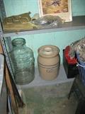 5 gal glass jug.  3 gal. butter churn
