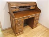 NEWER OAK ROLL TOP DESK.