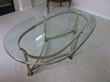 50" BEVELED THICK GLASS OVAL COFFEE TABLE WITH SOLID BRASS BASE

VERY STURDY