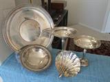 STERLING SILVER SERVING PIECES-LEFT TO RIGHT
ROUND PLATE-INTERNATIONAL STERLING #290
PEDISTAL DISH(MEDIUM/SMALL) E.B.ROGERS SILVER CO. #203
    MARGARET ROSE STERLING
DISH STERLING SILVER CEMENT REINFORCED W/STEEL ROD
STERLING SHELL DISH MEXICO-SIGNED PIECE