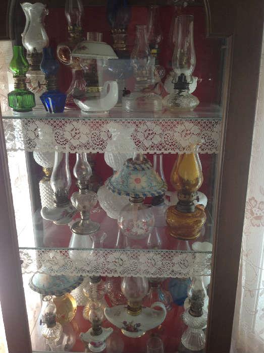 Lots of vintage oil lamps.