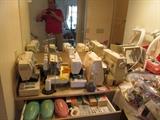 too many sewing machines to list and a serger plus all the supplies and stacks of fabric for sewing doll costumes