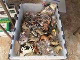 totes of plastic animals everything from anteaters to zebras