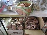 doll parts and monkey porcelin body parts made on site in working kiln