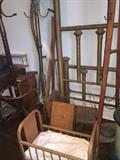 brass bed, doll baby bed, early scythe, umbrella stand--This is one corner of one of the many many rooms