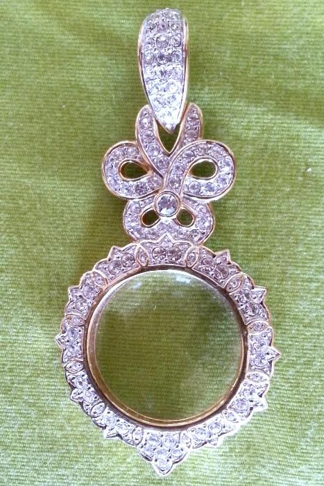 Swarovski magnifying glass pendant