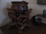 great carved wood puzzle stand with carved pot