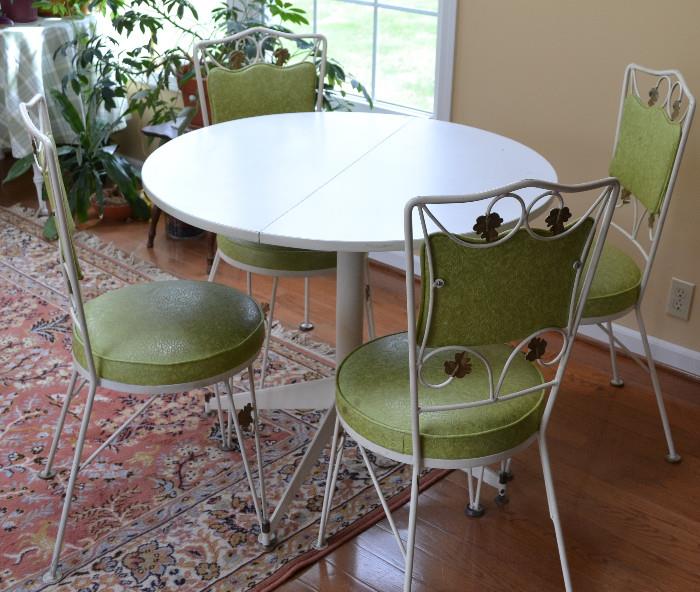 Retro Dinnette with Avocado Green Vinyl seating, white rod iron, white round table, Rug by Beaulieu of America