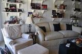 Hundreds of books, Cream Sofa and Chair with Ottoman (custom), Black Block Ottomans, Corvette books and paraphernalia