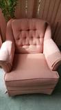 Pink chair swivels and rocks