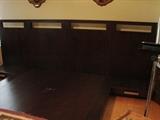 Custom made platform design bed stead with attached side tables.
